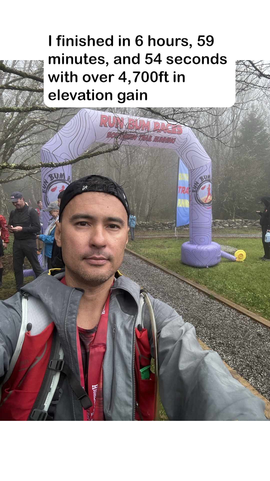 Brian at the Run Bum Races finish arch after a foggy mountain trail race
